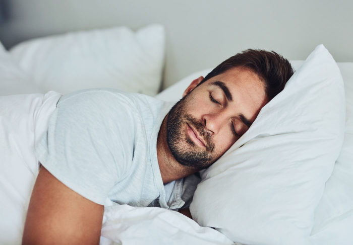 Image of a man sleeping restfully and comfortable